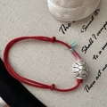 Red braided S925 sterling silver tortoise shell bracelet on vintage canvas background - 925 Silver / Red
