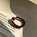 S925 silver beaded ring with red agate and carved charm on a vintage ceramic plate - Vintage Red Agate Carved Style (40JZ12)