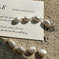 Baroque freshwater pearl necklace with gold OT clasp on a minimalist display card - 4-Tier Baroque Pearl Gold Jewelry (39ES23)