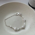 Elegante bracciale in argento S925 con ciondoli a coste a forma di pera su catena - Design a Texture Irregolare (SLT103)