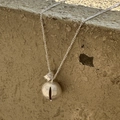 Minimalist S925 silver necklace with textured spherical pendant on a stone background - 925 Silver / Hammered Ball Style (XL198)