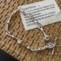 Retro S925 sterling silver bamboo knot toggle clasp bracelet on a textured mat - Bamboo Design Vintage Bracelet (SLS155) / 925 Silver