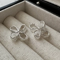 Elegant S925 sterling silver flower earrings with minimalist brushed metal texture - 925 Silver / Silver Hollow Flower Style (EHM077)
