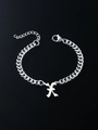 Detailed close-up of a silver Gothic letter K pendant on a trendy Cuban link chain bracelet - Letter X