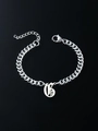 Detailed view of silver stainless steel Cuban link bracelet with Gothic letter G pendant - Letter G