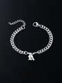 Macro shot of Cuban chain bracelet with Gothic K pendant and adjustable lobster clasp - Letter K