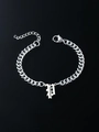 Detail of silver Cuban link bracelet with a Gothic letter P pendant and lobster clasp - Letter P