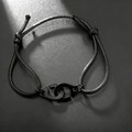 Minimalistisches schwarzes geflochtenes Armband mit schwarzen Handschellen-Verbindungselementen - Schwarzes Seil Schwarzmetall