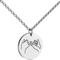 Macro shot of silver stainless steel round pendant featuring engraved pinky promise gesture - Pinky Swear