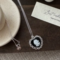 S925 sterling silver heart necklace with black cameo rose on vintage wooden surface - 925 Silver / Black