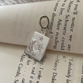 S925 sterling silver rectangular crescent moon and star pendant on a vintage book page - Star Moon Embossed Rectangular Pendant Necklace (DZ134) / 925 Silver