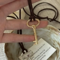 Vintage key pendant necklace with polished metal and brown velvet cord for women - 925 Silver / Gold