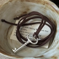 Vintage S925 silver key pendant necklace with dark brown suede cord on a ceramic dish - 925 Silver / Silver