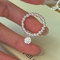 S925 sterling silver beaded ring with a smiling sun pendant on a hand model - Adjustable Open / Sun Smile Charm Style (1JZ45)