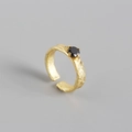 Irregular foil texture gold ring featuring a black zircon stone in four-prong setting - Adjustable Open / Gold