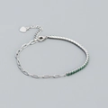 S925 Silberarmband mit grünen Zirkonia-Steinen und kleinem Herz-Anhänger-Detail - 925er Silber / Platinfarbe (Grüner Stein)