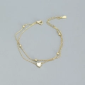 Elegante pulsera de doble capa dorada con corazón y cuentas con cadena ajustable - Dorado