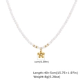 Gold flower pendant necklace with white imitation pearls and crystal centerpiece - Flower Pendant White Pearl Chain (NC-2400)
