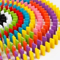 Set of 120 colorful wooden rainbow domino blocks arranged in a spiral for kids' education - 120 Pieces Rainbow Dominoes