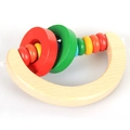 Rainbow colored wooden baby rattle toy with natural wood texture on white background - Semicircle