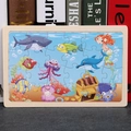 Wooden ocean puzzle for kids featuring sharks and dolphins with a cartoon marine design - Underwater Treasure