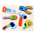 Wooden cartoon tool puzzle for toddlers featuring a saw, hammer, and pliers on a white board - Tool Set