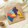 Wooden dolphin puzzle for kids with colorful blue and red geometric shapes on wood base - Dolphin
