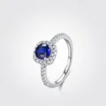 Halo S925 sterling silver ring with deep blue square cut stone and side accent diamonds - US Size 5 / Silver