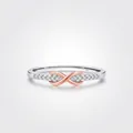 S925 Sterling Silber Möbius Unendlichkeitsring mit funkelnden Diamanten und Roségold-Details - US Größe 5 / 925 Sterlingsilber