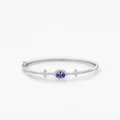Eleganter s925 Silberarmreif mit ovalem blauem Edelstein und glitzerndem Diamantbesatz - 925er Silber / Silber Stil