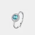 Elegante anillo de plata S925 con una piedra azul Paraiba redonda y un halo de diamantes - Talla US 5 / Plateado