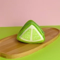 Plush lime slice coin purse with zipper closure on an oval wooden tray - Lemon Triangle Coin Purse / Approximately 815cm
