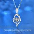 Silver 925 heart pendant necklace with moissanite center stone on blue background - 0.5ct Heart of the Ocean Style (XMZ023) / 925 Silver