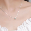 Elegant moissanite crown necklace in S925 sterling silver worn by a model - 925 Silver / 0.5 Carat Crown Six-Prong Moissanite Necklace (Green)
