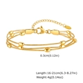 Detail of 18K gold-plated triple-layer snake chain bracelet with movable beads and lobster clasp - Gold Bracelet