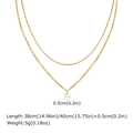 Detail van gouden dubbellaagse ketting met 0,5 cm zirkoon hanger en afmetingen - Goud