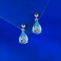 Elegant S925 silver earrings featuring pear-cut light blue teardrop gemstones - 925 Silver / Aqua