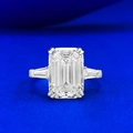 Classic S925 silver ring featuring emerald cut center stone with side tapered baguette diamonds - US 5 / Silver