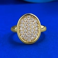 Elegant gold oval ring with micro-pave crystals on a deep blue background - US 5 / Gold
