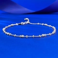 Detailed macro view of S925 silver beaded bracelet with faceted beads and star charm - Adjustable Pull-out / Silver