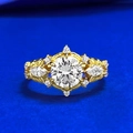 Elegant gold vintage ring with round main diamond and marquise accents on blue background - US 5 / Gold