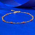 Detail showing the gold beaded chain with red multifaceted gemstones and floral charms - Adjustable Pull-out / Summer Orange