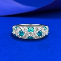 S925 silver eternity ring featuring vibrant green and blue crystals on a blue background - US 5 / Elf Green