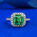 Classic S925 silver halo ring featuring an emerald cut green gemstone on blue background - US 5 / Emerald Green (R1237)