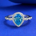 Elegante S925 zilveren ring met een peervormige blauwe edelsteen en halo-zetting - US 6 / Aqua