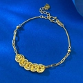 Elegante bracciale a catena in argento S925 placcato oro con cinque monete su sfondo blu - Regolabile / Stile Oro Cinque Monete