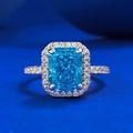 Luxurious radiant cut blue gemstone engagement ring with halo diamonds and silver band - US 5 / Sea Blue Zirconia (R1131)