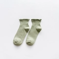 Light green cotton knit ankle socks featuring elegant ruffle trim and ribbed texture - One Size / Green
