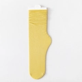 Ginger yellow slouch socks with vertical ribbed knit texture for women on white background - One Size / Bright yellow