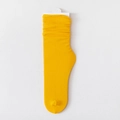 Vibrant yellow ribbed slouch socks for women in soft velvet finish with retail packaging - One Size / Turmeric